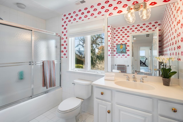 38 Yarmouth Rd, Norwalk, CT 06853 - full bath featuring toilet, enclosed tub / shower combo, vanity, tile patterned floors, and tile walls