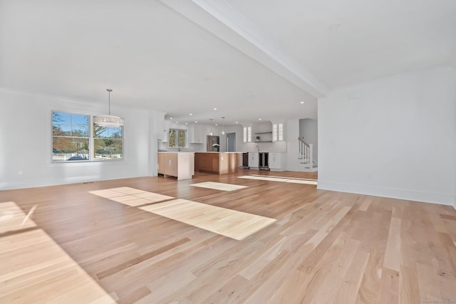 71 Reid St, Fairfield, CT 06824 - unfurnished living room featuring stairs, light wood-style flooring, baseboards, and recessed lighting
