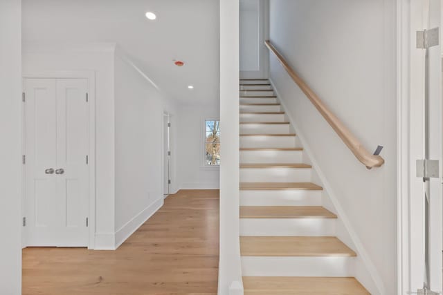 71 Reid St, Fairfield, CT 06824 - staircase with wood finished floors, recessed lighting, and baseboards