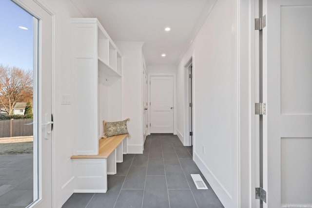 71 Reid St, Fairfield, CT 06824 - mudroom featuring plenty of natural light, dark tile patterned floors, baseboards, and recessed lighting