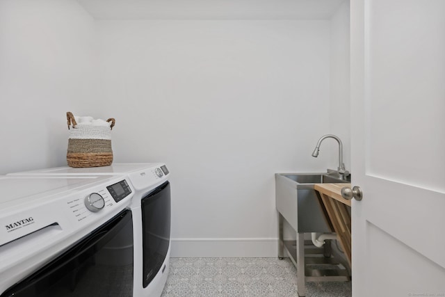 71 Reid St, Fairfield, CT 06824 - laundry room featuring washing machine and clothes dryer and baseboards