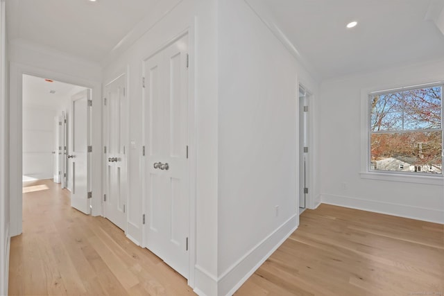 71 Reid St, Fairfield, CT 06824 - hallway with light wood finished floors, baseboards, and recessed lighting