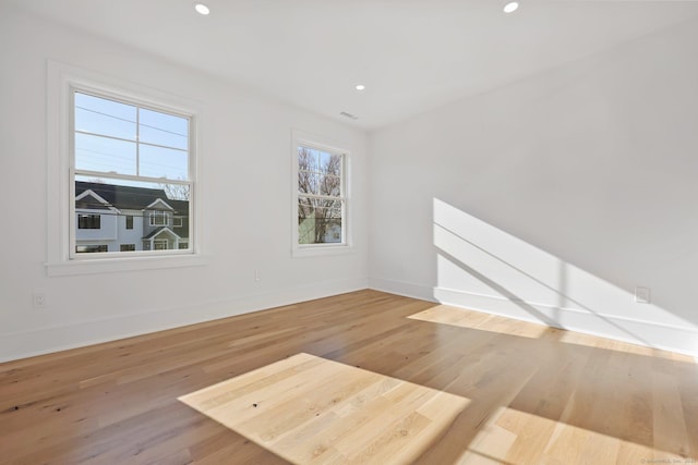71 Reid St, Fairfield, CT 06824 - empty room with wood finished floors, baseboards, and recessed lighting
