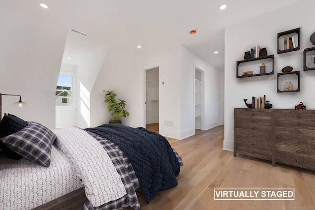 71 Reid St, Fairfield, CT 06824 - bedroom featuring light wood finished floors, recessed lighting, a spacious closet, and baseboards