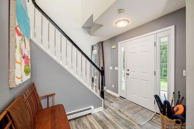 18 Tunnel Rd, Roxbury, CT 06783 - entryway with a baseboard radiator, wood finished floors, healthy amount of natural light, and stairway