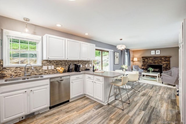 18 Tunnel Rd, Roxbury, CT 06783 - kitchen featuring stainless steel dishwasher, a sink, open floor plan, white cabinets, and recessed lighting