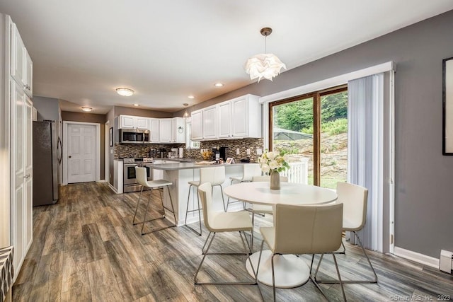 18 Tunnel Rd, Roxbury, CT 06783 - dining area with dark wood-type flooring and baseboards