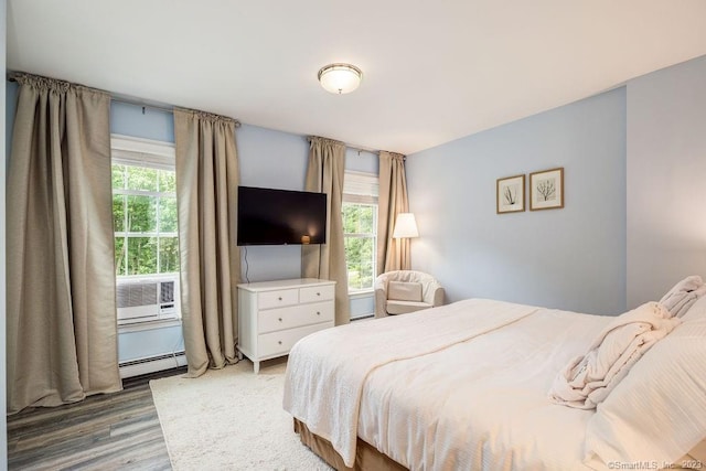 18 Tunnel Rd, Roxbury, CT 06783 - bedroom with baseboard heating and wood finished floors