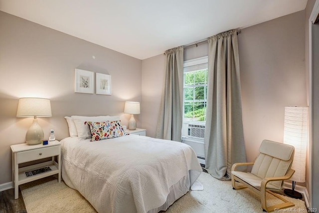 18 Tunnel Rd, Roxbury, CT 06783 - bedroom featuring a baseboard heating unit, cooling unit, baseboards, and wood finished floors
