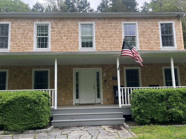 18 Tunnel Rd, Roxbury, CT 06783 - view of front facade with covered porch and mansard roof