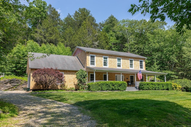 18 Tunnel Rd, Roxbury, CT 06783 - colonial house featuring a front yard and covered porch