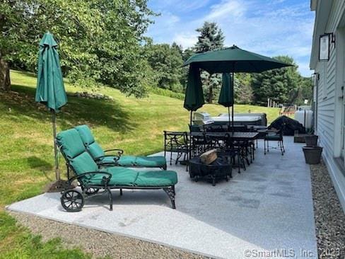 view of patio featuring outdoor dining space