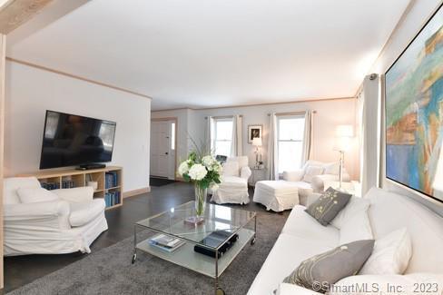 living area featuring baseboards