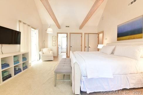 carpeted bedroom featuring beam ceiling, visible vents, two closets, and high vaulted ceiling