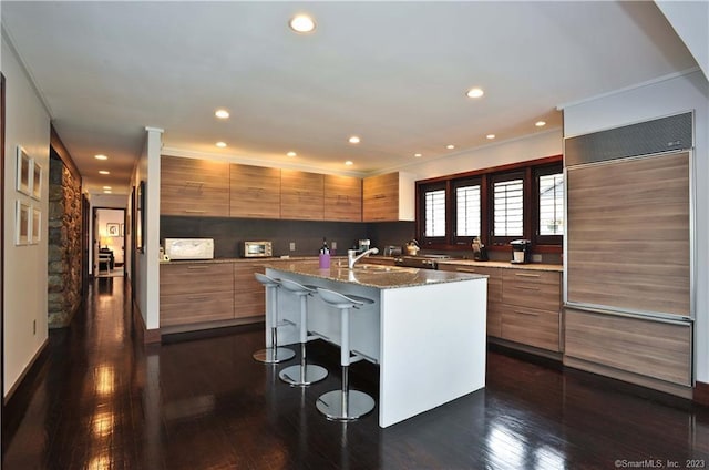 247 Painter Hill Rd, Roxbury, CT 06783 - kitchen featuring paneled built in fridge, modern cabinets, brown cabinetry, and recessed lighting