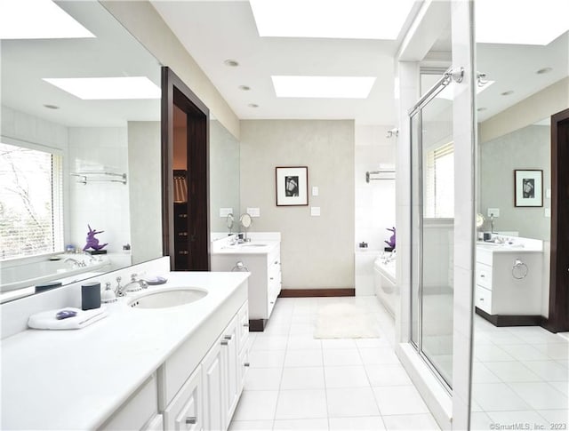 247 Painter Hill Rd, Roxbury, CT 06783 - bathroom with a skylight, two vanities, a bath, and a stall shower