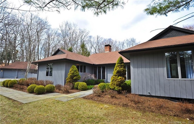 247 Painter Hill Rd, Roxbury, CT 06783 - view of side of property with a chimney and a yard