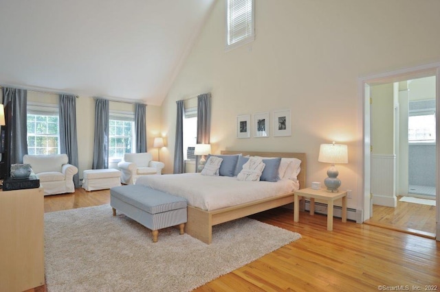 45 Moosehorn Rd, Roxbury, CT 06783 - bedroom with high vaulted ceiling, wood finished floors, and a baseboard radiator