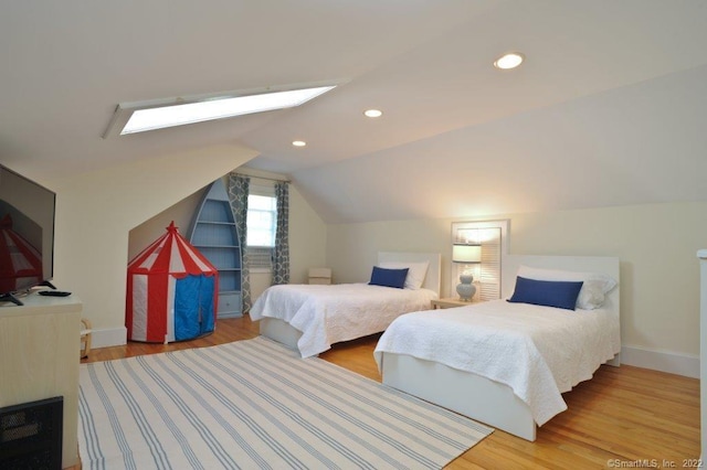 45 Moosehorn Rd, Roxbury, CT 06783 - bedroom with baseboards, vaulted ceiling with skylight, recessed lighting, and wood finished floors