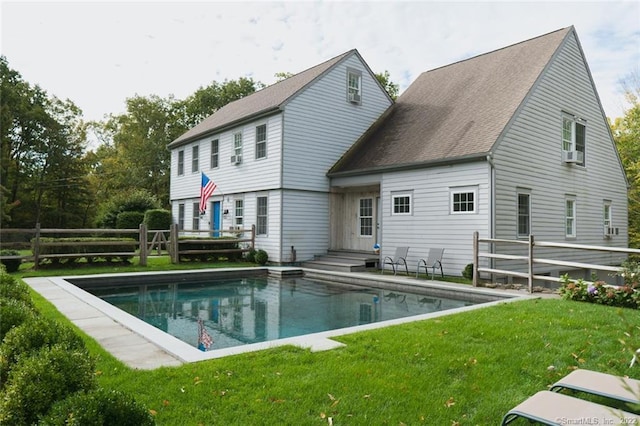 45 Moosehorn Rd, Roxbury, CT 06783 - rear view of house featuring fence, entry steps, an outdoor pool, a lawn, and a shingled roof