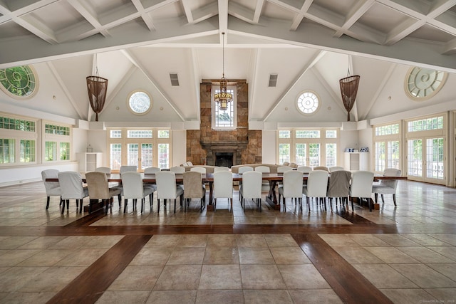 10 Sunny Ridge Rd, Washington, CT 06793 - dining room with beam ceiling, high vaulted ceiling, healthy amount of natural light, and a fireplace