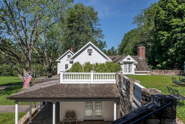 10 Sunny Ridge Rd, Washington, CT 06793 - back of house featuring french doors, a lawn, and a chimney