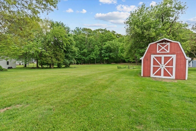 129 Mohawk Dr, Wallingford, CT 06492 - view of grassy yard featuring an outdoor structure and a barn