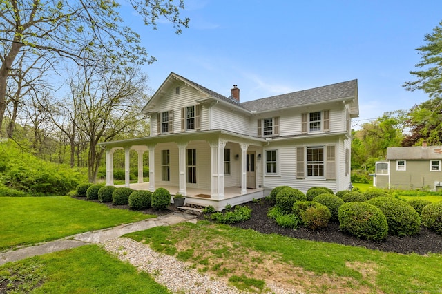 4 Lime Rock Holw, Salisbury, CT 06039 - farmhouse-style home featuring a porch, a front yard, and a chimney