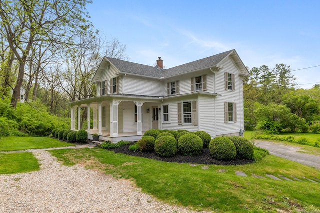 4 Lime Rock Holw, Salisbury, CT 06039 - view of front of house with covered porch, a chimney, a front lawn, asphalt driveway, and roof with shingles