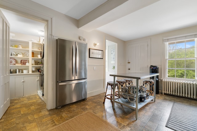 4 Lime Rock Holw, Salisbury, CT 06039 - kitchen featuring freestanding refrigerator, radiator, and dark stone finish floors
