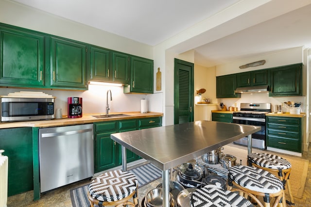 4 Lime Rock Holw, Salisbury, CT 06039 - kitchen with appliances with stainless steel finishes, a sink, under cabinet range hood, and green cabinetry