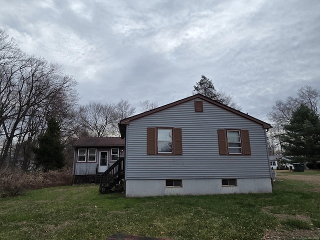 179 Spring St, Windsor Locks, CT 06096 - view of side of home with a lawn