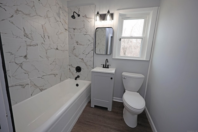 136 Cooper Dr, Waterbury, CT 06704 - bathroom with vanity, toilet, baseboards, bathing tub / shower combination, and wood finished floors
