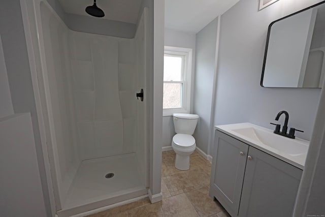 136 Cooper Dr, Waterbury, CT 06704 - bathroom featuring toilet, vanity, baseboards, and a shower stall