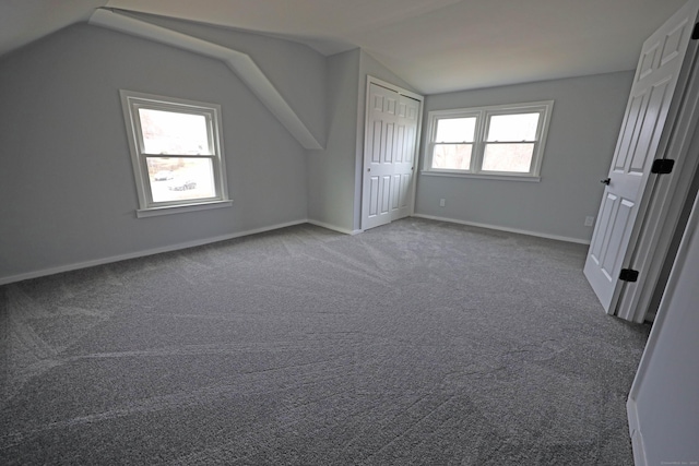 136 Cooper Dr, Waterbury, CT 06704 - unfurnished bedroom with baseboards, lofted ceiling, and carpet flooring