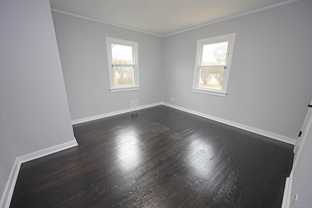 136 Cooper Dr, Waterbury, CT 06704 - unfurnished room with visible vents, dark wood-type flooring, baseboards, and crown molding