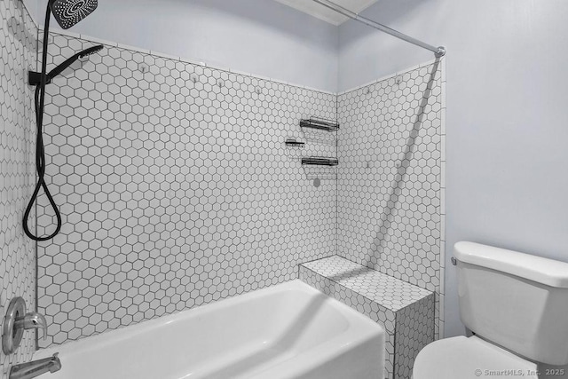 full bathroom with toilet and bathtub / shower combination