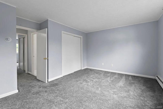 unfurnished bedroom with a closet, baseboards, and carpet floors