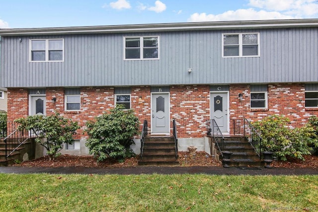 view of front of home featuring brick siding