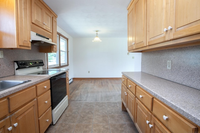 kitchen featuring light countertops, baseboards, tasteful backsplash, under cabinet range hood, and range with electric cooktop