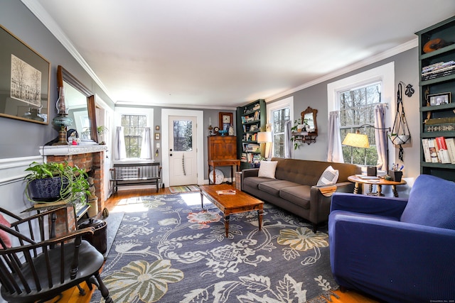 270 Berkshire Rd, Newtown, CT 06482 - living room featuring wood finished floors, a fireplace, and ornamental molding