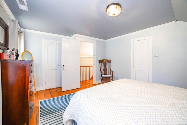 270 Berkshire Rd, Newtown, CT 06482 - bedroom featuring baseboards, visible vents, light wood-type flooring, and ornamental molding