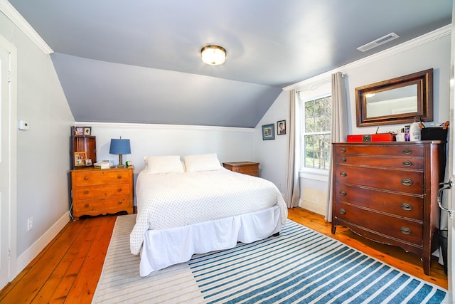 270 Berkshire Rd, Newtown, CT 06482 - bedroom with baseboards, visible vents, hardwood / wood-style flooring, and vaulted ceiling