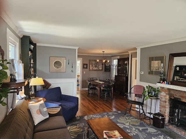 270 Berkshire Rd, Newtown, CT 06482 - living area featuring wainscoting, ornamental molding, a notable chandelier, and dark wood finished floors