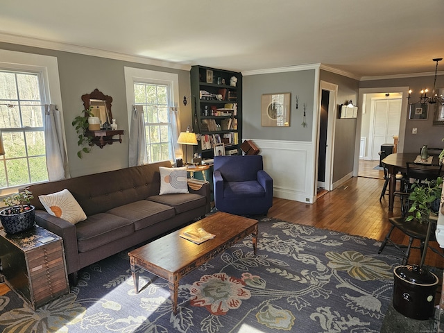 270 Berkshire Rd, Newtown, CT 06482 - living room with an inviting chandelier, crown molding, and wood finished floors