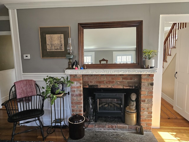 270 Berkshire Rd, Newtown, CT 06482 - room details with a brick fireplace, wainscoting, crown molding, and wood finished floors