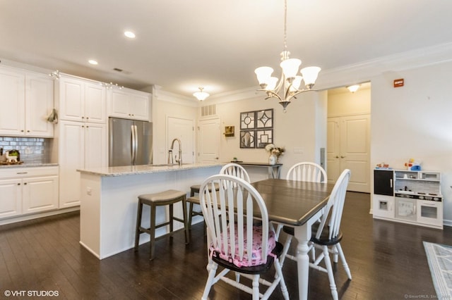 1026 Country View Rd Unit 1026, Danbury, CT 06810 - dining space featuring an inviting chandelier, ornamental molding, recessed lighting, visible vents, and dark wood-style floors