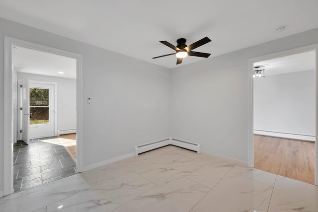 spare room featuring marble finish floor, baseboards, and a ceiling fan