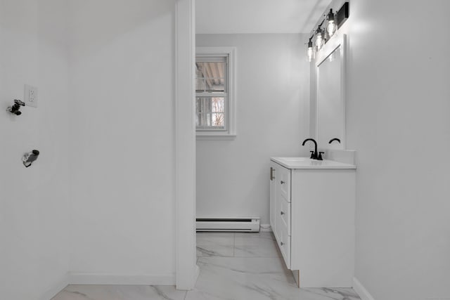 bathroom with baseboards, marble finish floor, vanity, and baseboard heating