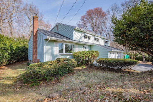 view of property exterior with a chimney